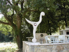 Querciolaie 4's private outdoor area includes a fanciful sculpture.